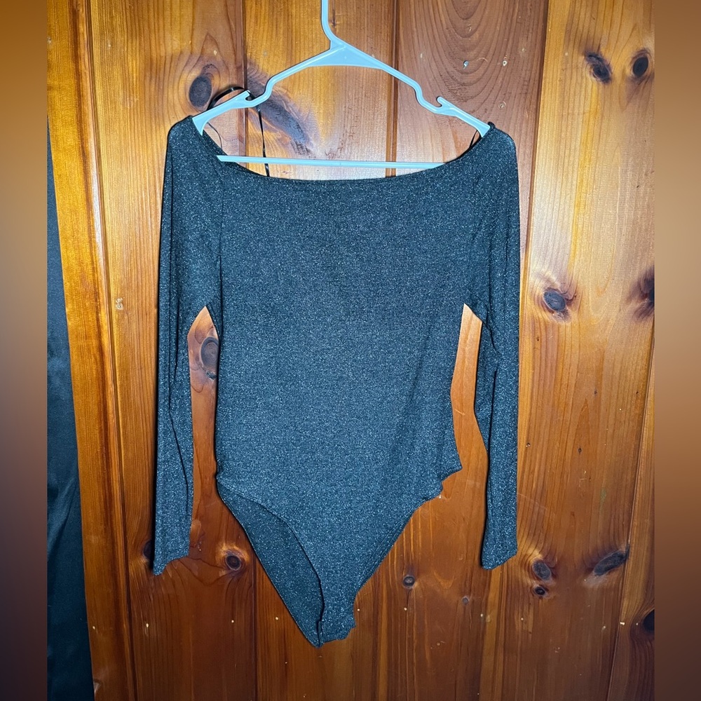 This large sparkly bodysuit been worn once, is a grainy texture, but not itchy